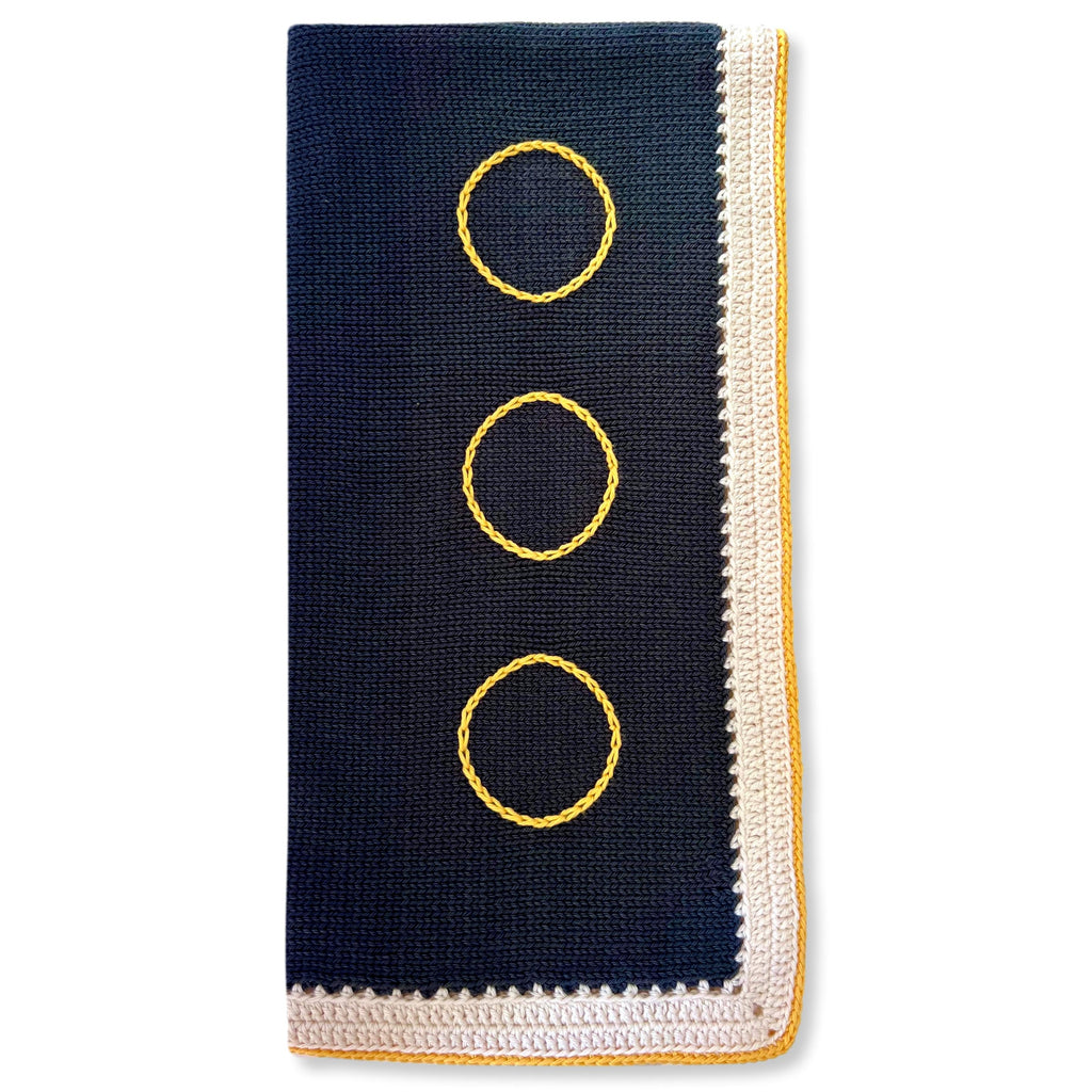 Dark gray baby blanket with yellow trim and white border - made in Haiti by moms