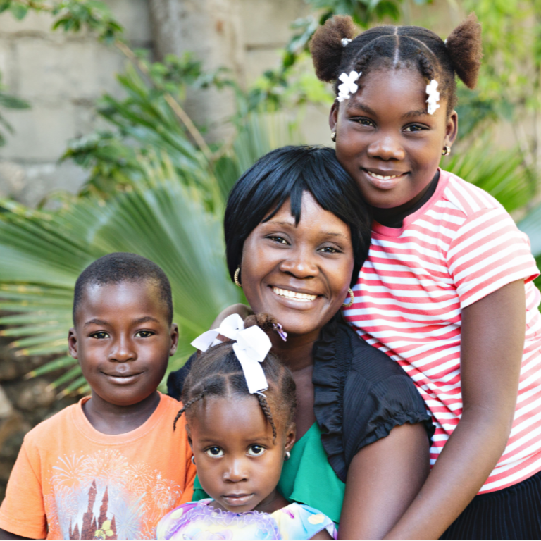 Haitian mother & children from Haiti Babi - Artisan Baby Products, Blanket, Beanies, Hats, Lovies, Soothers, Teethers
